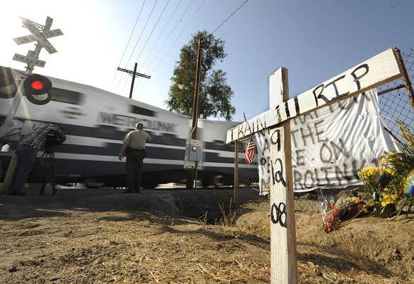 Metrolink 111 crosses Chatsworth Street near the site of the Sept. 12 crash that claimed 25 lives.