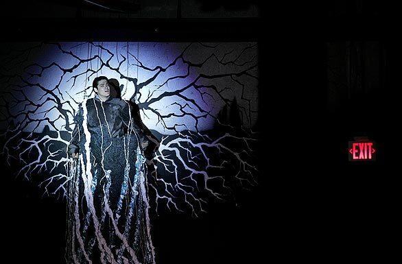 Jason Adams, as Tom, during Overtone Industries' "Songs and Dances of Imaginary Lands," which is performed inside a former car dealership in Culver City.