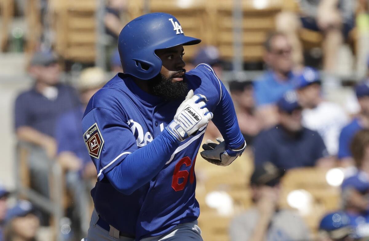 Dodgers' Andrew Toles runs to first during a 2018 spring training game against the Chicago White Sox.