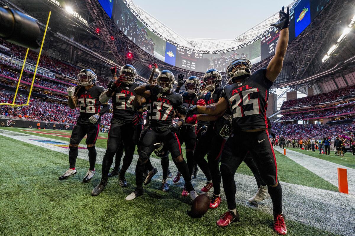 Atlanta Falcons cornerback Dee Alford celebrates with teammates after his late interception against the Cleveland Browns.