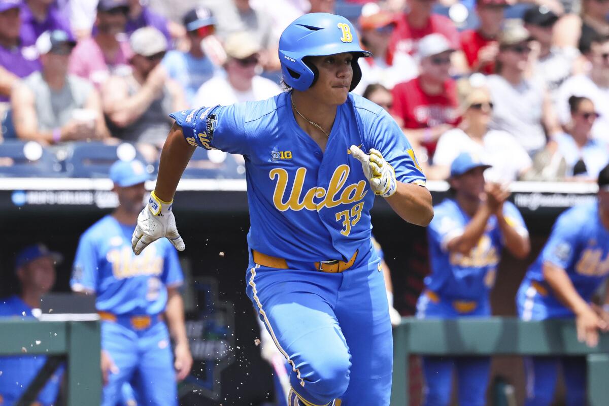 UCLA's Mulivai Levu runs to first base against Murray State on Saturday.