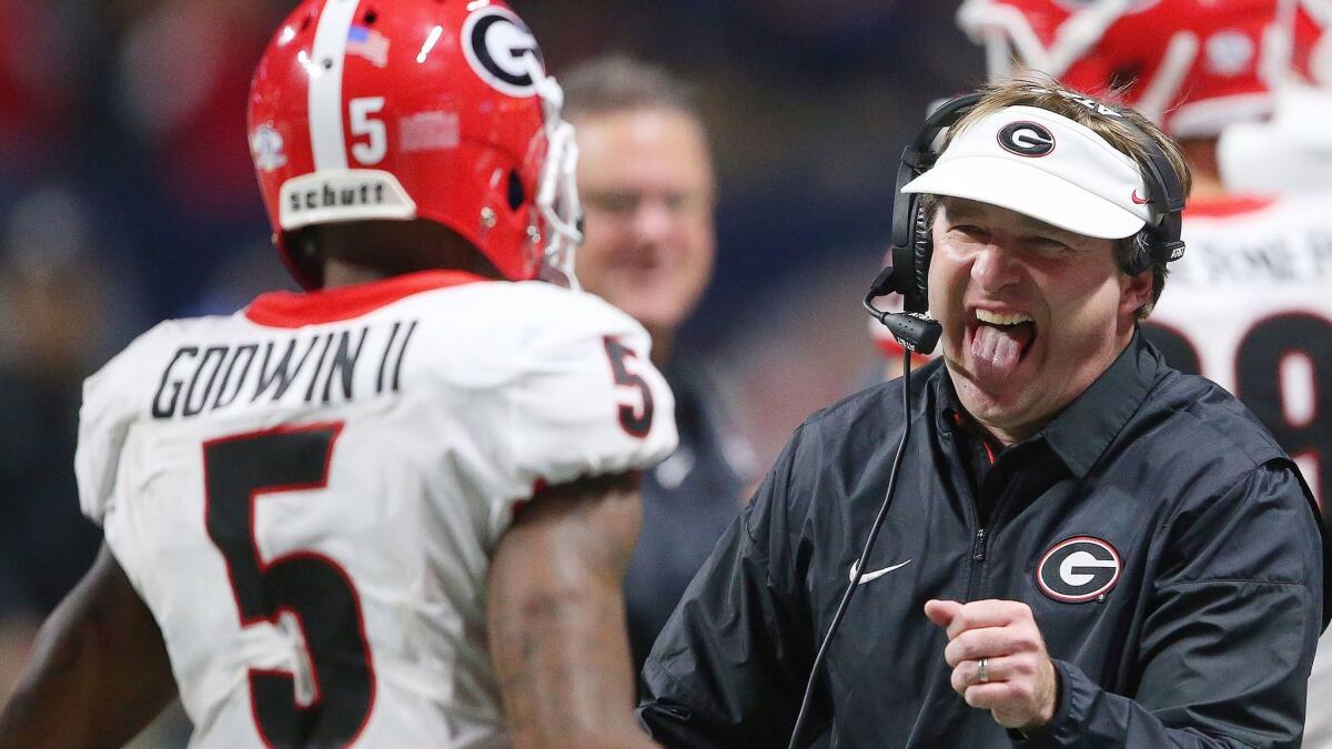 Georgia head coach Kirby Smart reacts after Georgia wide receiver Terry Godwin scored a touchdown against Auburn during the second half of the Southeastern Conference championship.