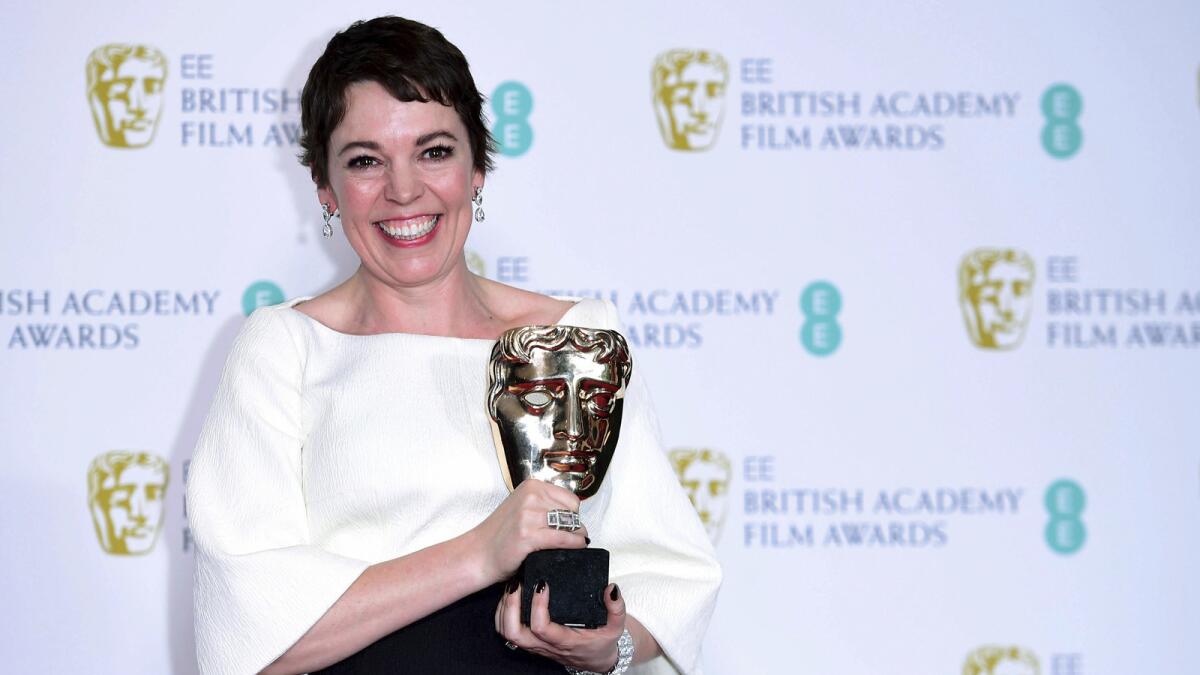 Olivia Colman with her BAFTA for best actress in a leading role for "The Favourite" poses in the press room at the 72nd British Academy Film Awards at the Grosvenor House Hotel in London on Sunday, Feb. 10, 2019.