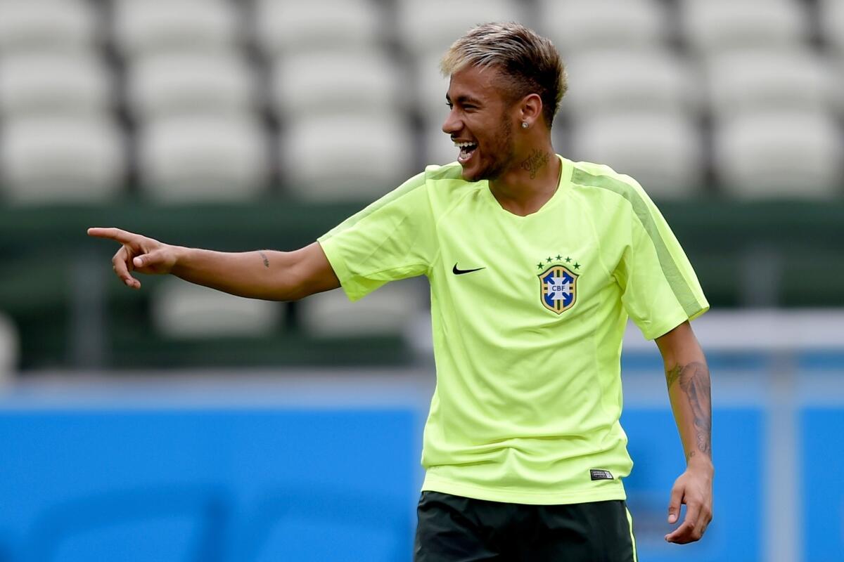 Neymar smiles during a training session Monday at Castelao Stadium in Fortaleza, Brazil.