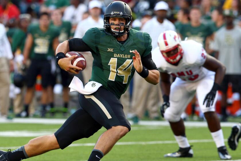 Baylor quarterback Bryce Petty breaks into the Southern Methodist secondary on a run in the first half Sunday at McLane Stadium in Waco, Texas.