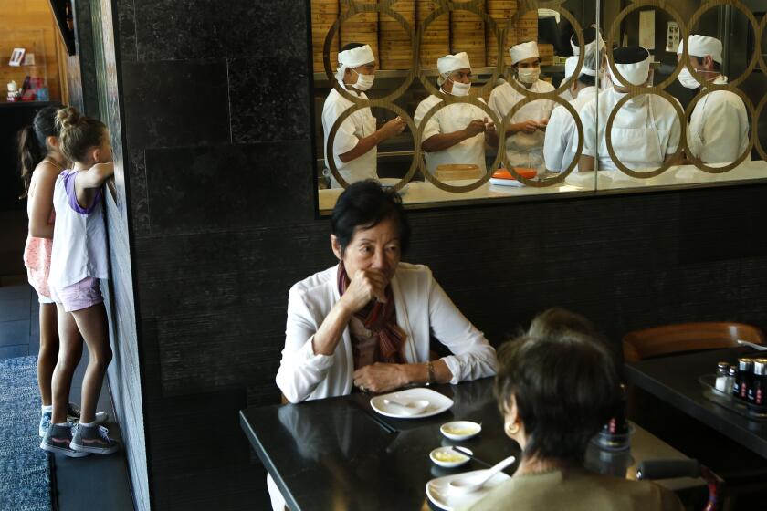  Chefs, background, prepare dumplings at Din Tai Fung,