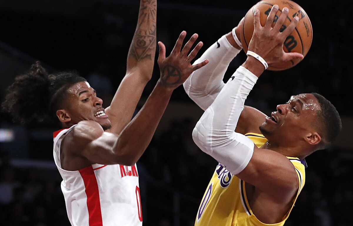 Houston Rockets guard Jalen Green defends Lakers guard Russell Westbrook.