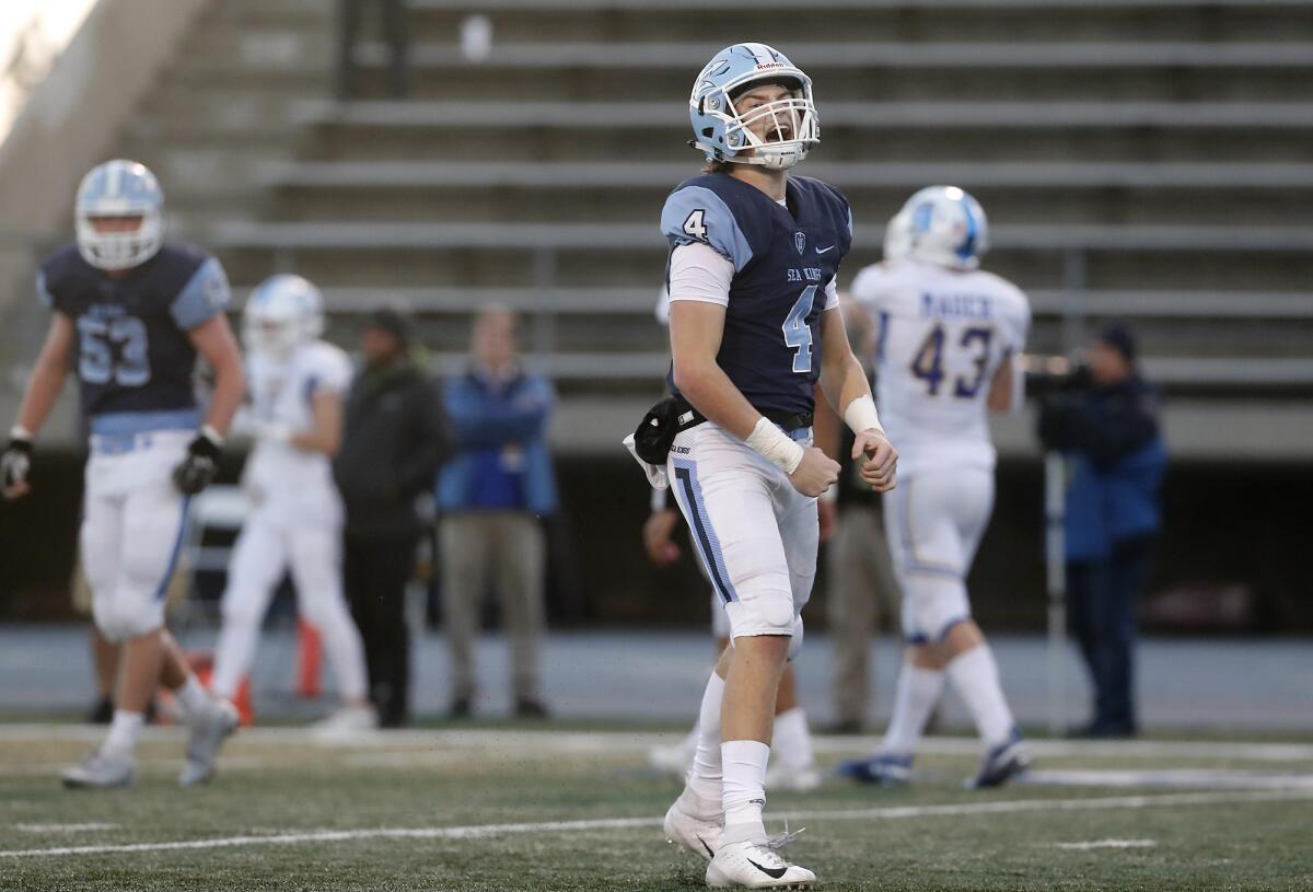 Corona del Mar's Ethan Garbers reacts after throwing a six-yard touchdown to Bradley Schlom, not pictured, in the second quarter against Serra in the CIF State Division 1-A title game on Saturday at Cerritos College. The touchdown pass gave Garbers the section's single-season record, and the senior ended the year with 71.