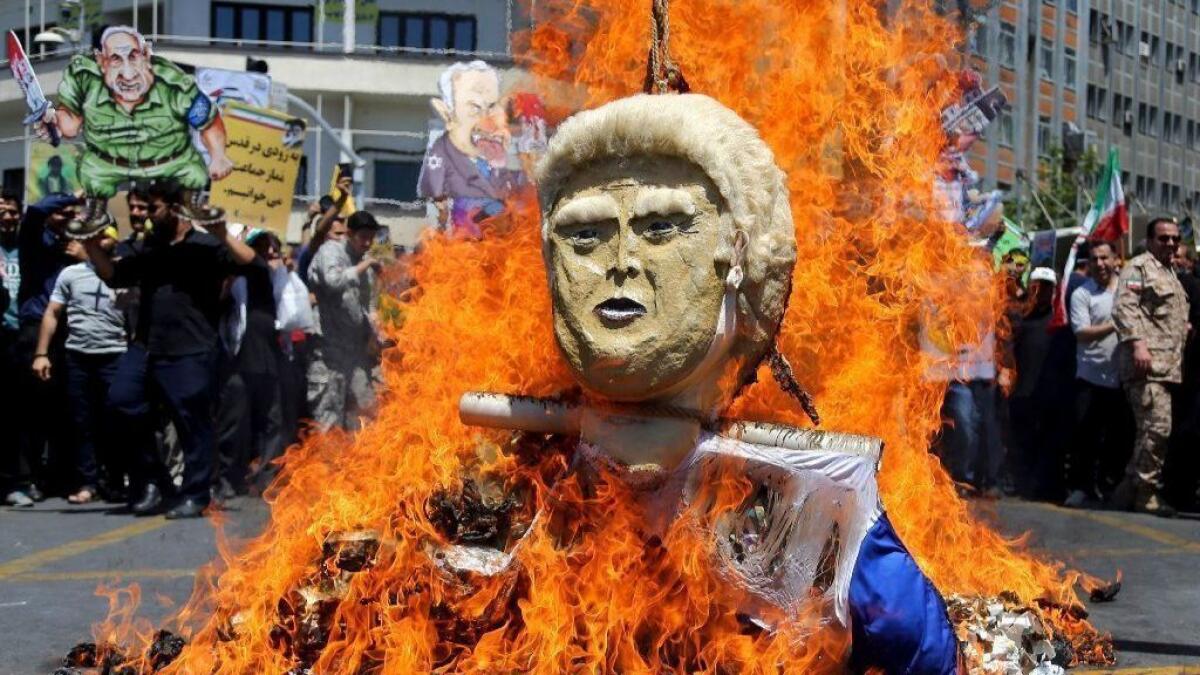 An effigy of President Trump is set on fire during annual anti-Israel protests organized by the Iranian government on June 8, 2018, in Tehran.