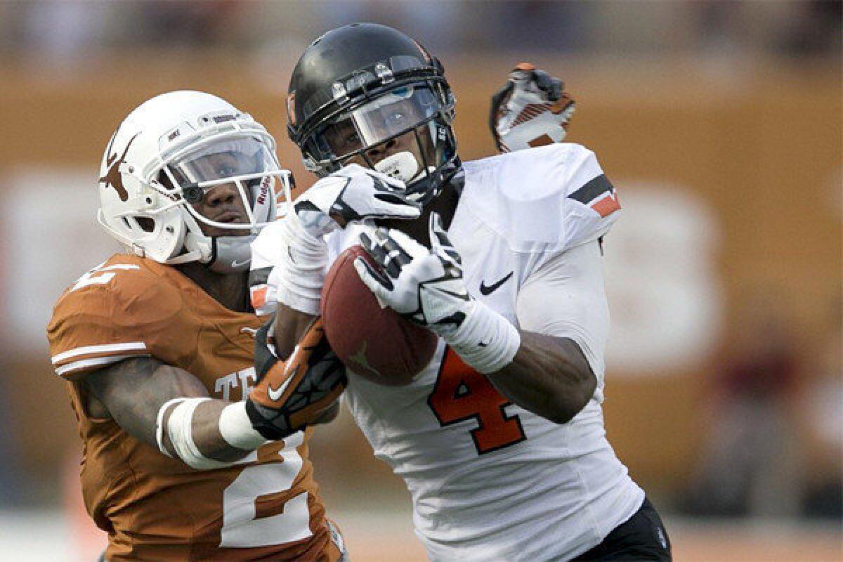 Oklahoma State's Justin Gilbert intercepts a pass intended for Texas' Kendall Sanders on Nov. 16 at Royal Memorial Stadium in Austin, Texas. Gilbert has intercepted six passes this season including two against the Longhorns.