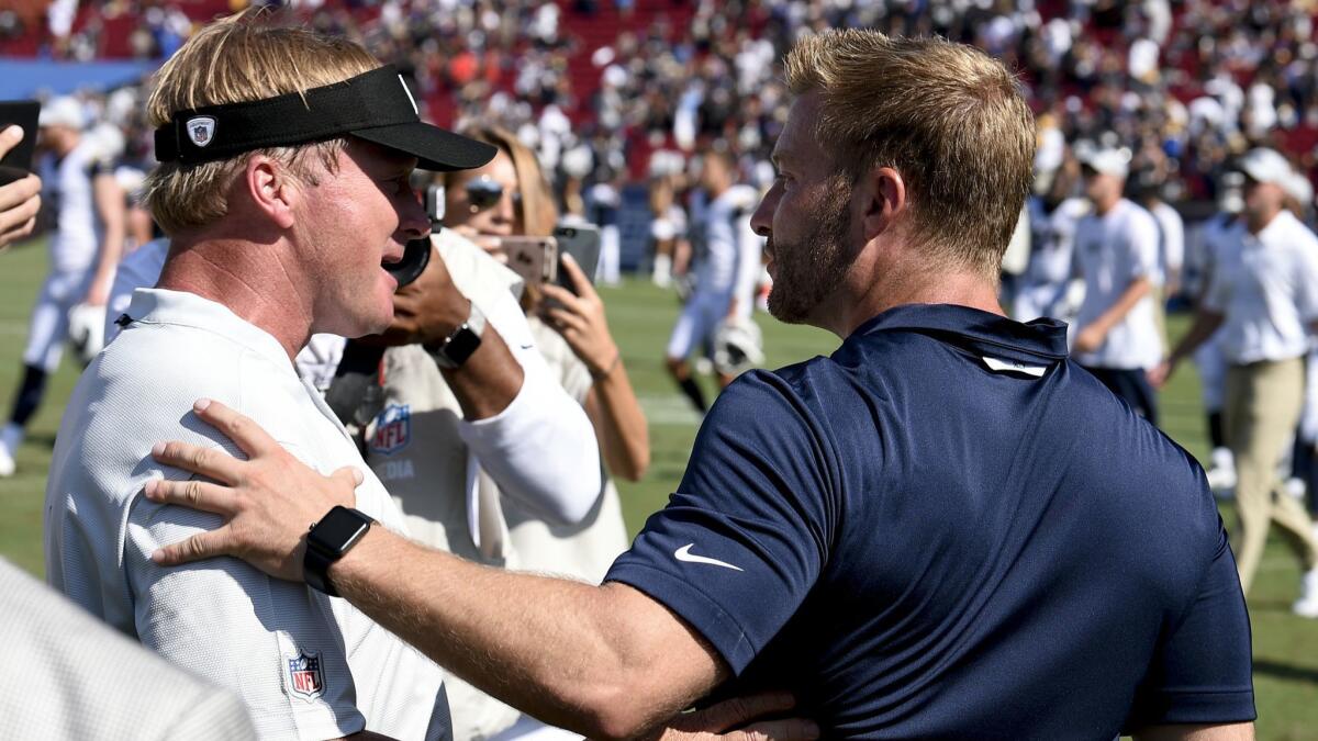 Coaches Jon Gruden of the Raiders and Sean McVay of the Rams greet each other after their preseason game on Aug. 18. They will meet again on Sept. 10 in Oakland.