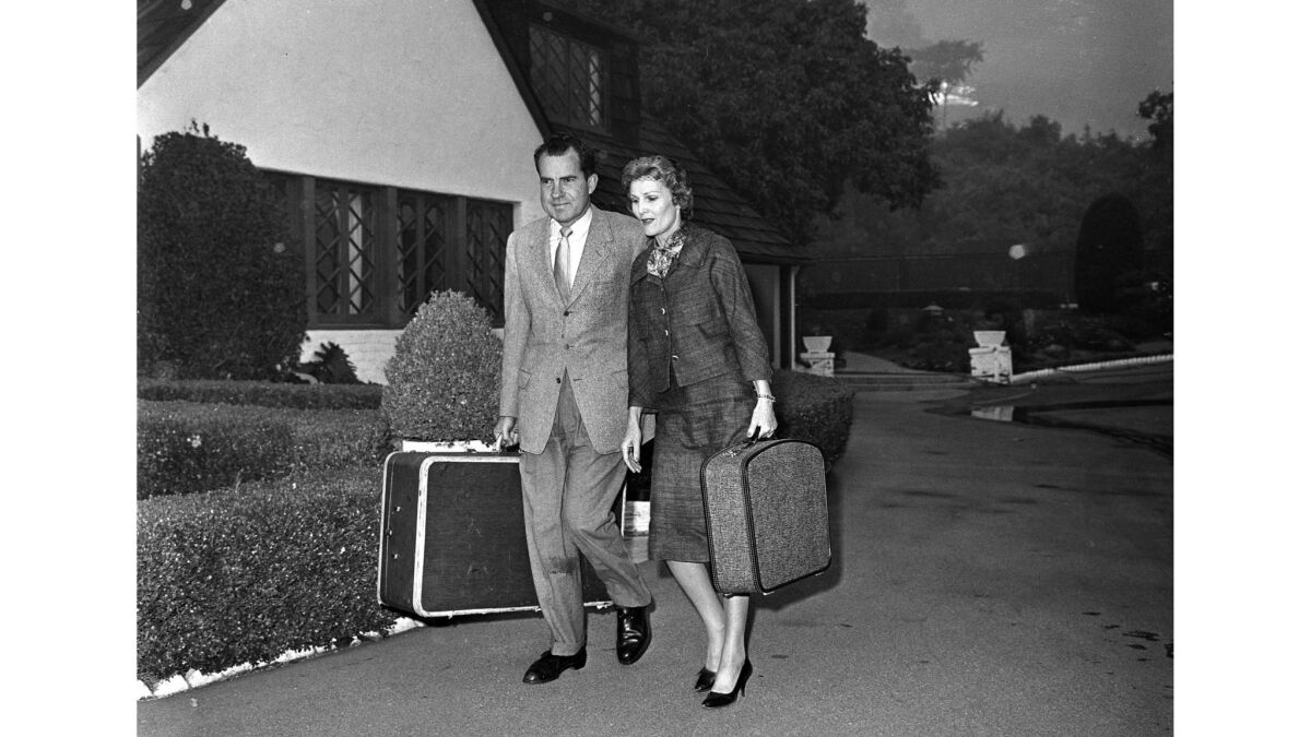 Nov. 6, 1961: Former Vice President Richard Nixon and his wife Pat leave their rented home on Bundy Drive in Brentwood.