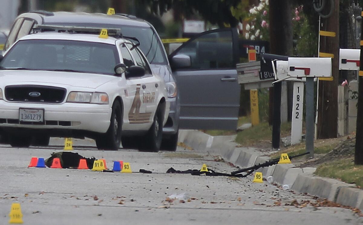 Evidence markers dot the scene after the police shootout with Syed Rizwan Farook and Tashfeen Malik in San Bernardino.