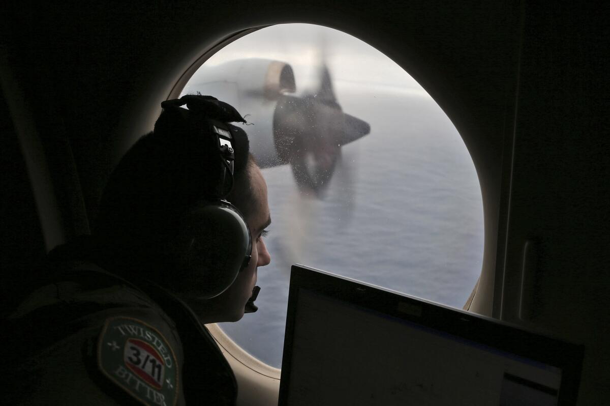 Flight officer Rayan Gharazeddine on board a Royal Australian Air Force search plane.