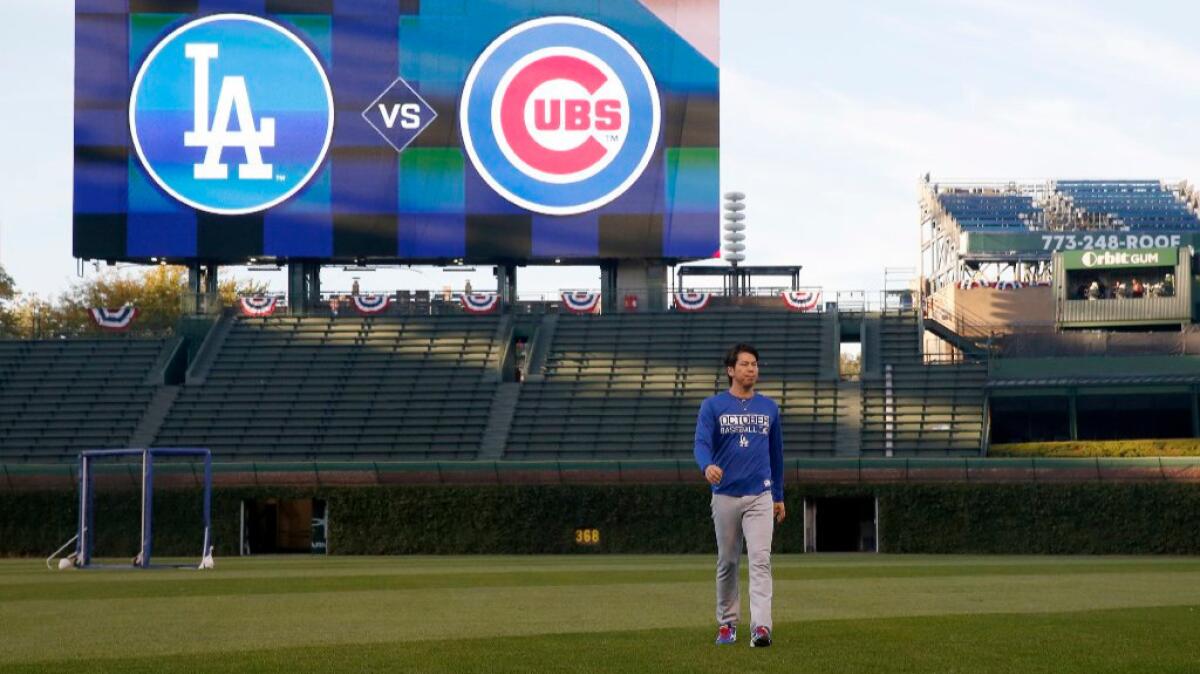 Dodgers pitcher Kenta Maeda works out at Wrigley Field on Friday ahead of his team's National League Championship Series against the Cubs. Maeda will start Game 1 on Saturday.