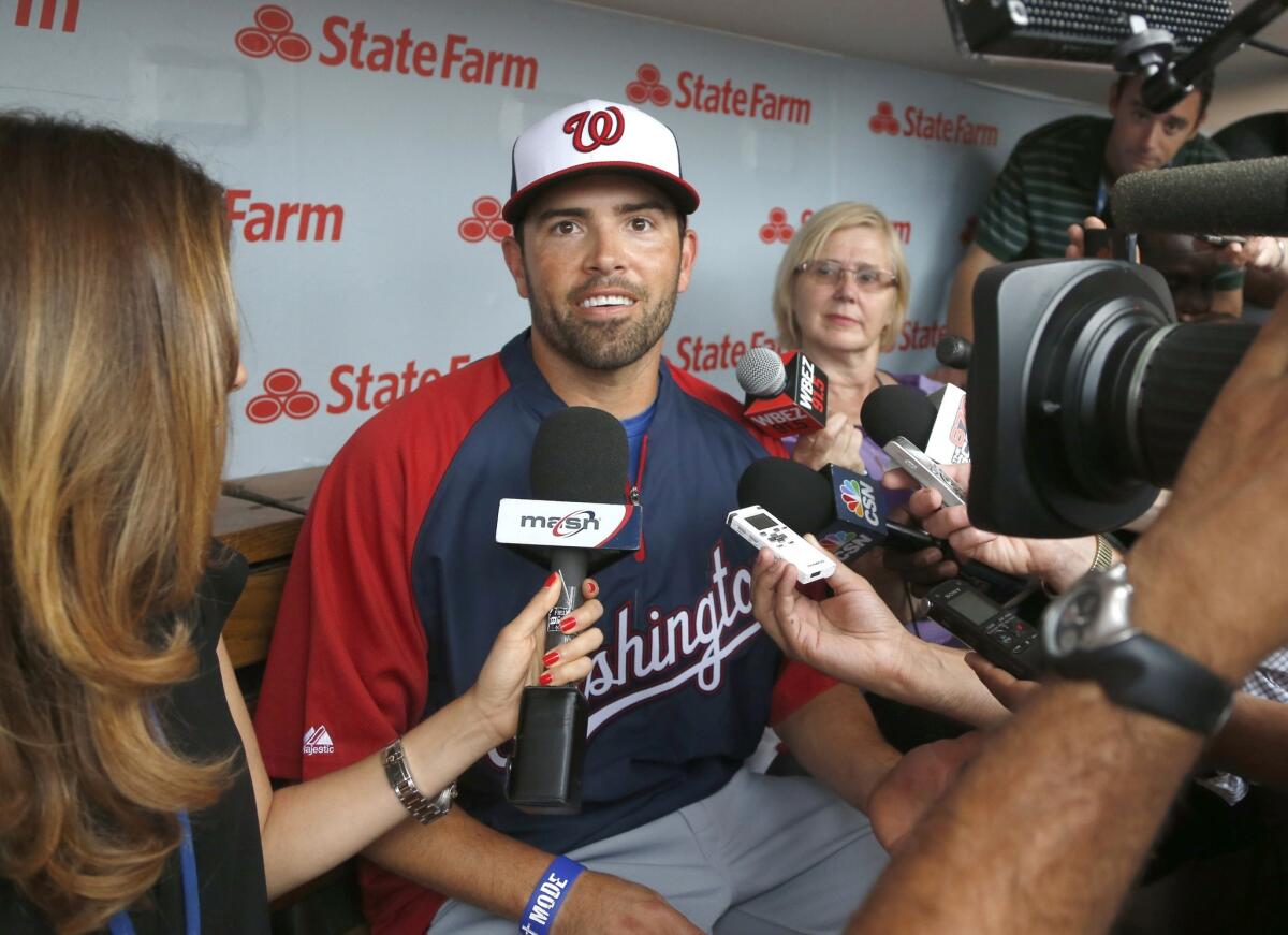 David DeJesus speaks with reporters before his first game with the Washington Nationals on Monday.
