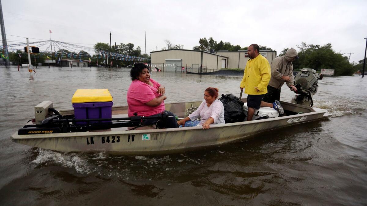A privately owned boat ferries evacuees to safety in rising floodwaters from Tropical Storm Harvey in Houston, Texas on Aug. 28.