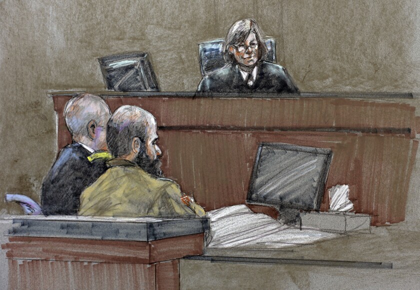 In this courtroom sketch, Maj. Nidal Hasan, center, sits before the judge, U.S. Army Col. Tara Osborn, during the sentencing phase of his trial at Ft. Hood, Texas.