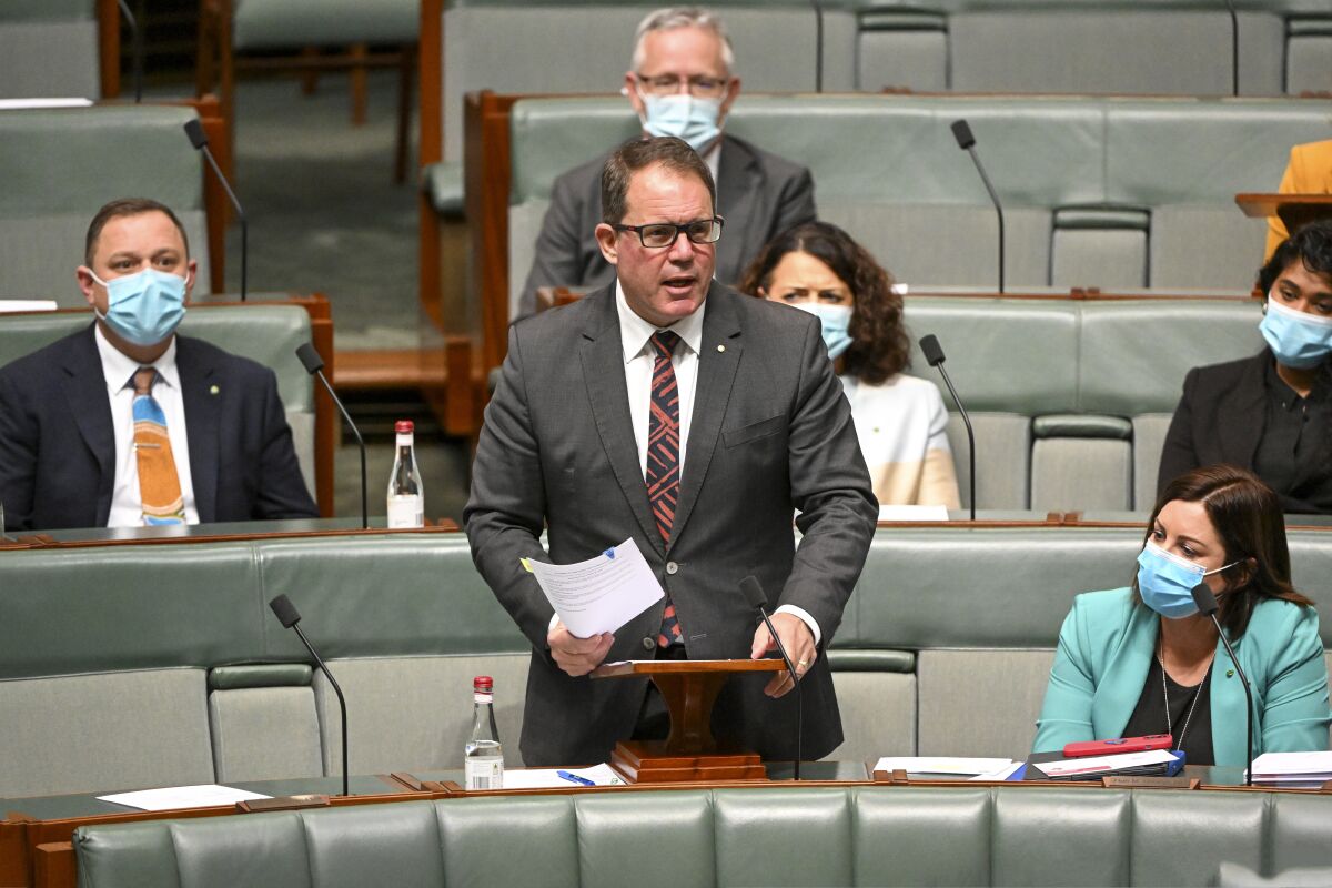 Labor member for Solomon, Luke Gosling introduces the Restoring Territory Rights Bill in the House of Representatives at Parliament House in Canberra, Australia, Monday, Aug. 1, 2022. The Australian Parliament is considering a bill that would lift a 25-year-old ban on two territories legalizing voluntary euthanasia. (Mick Tsikas/AAP Image via AP)