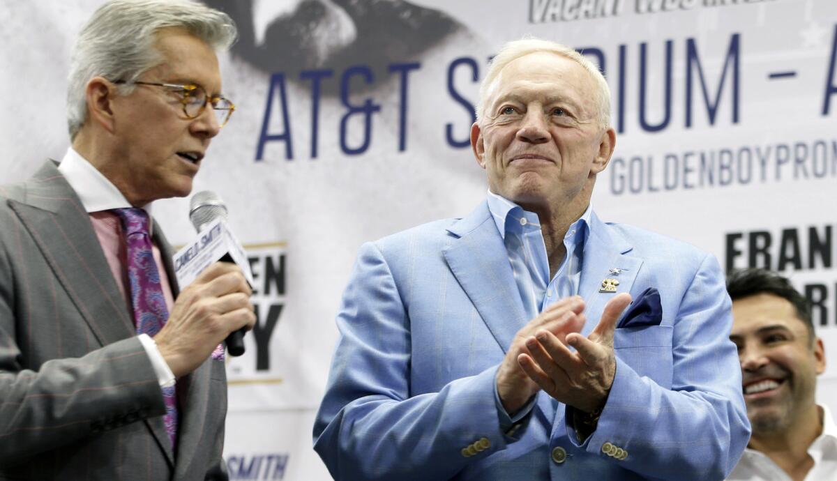 Cowboys owner Jerry Jones listens to Michael Buffer, left, introduce Canelo Alvarez and Liam Smith during their weigh-in Friday at AT&T Stadium.