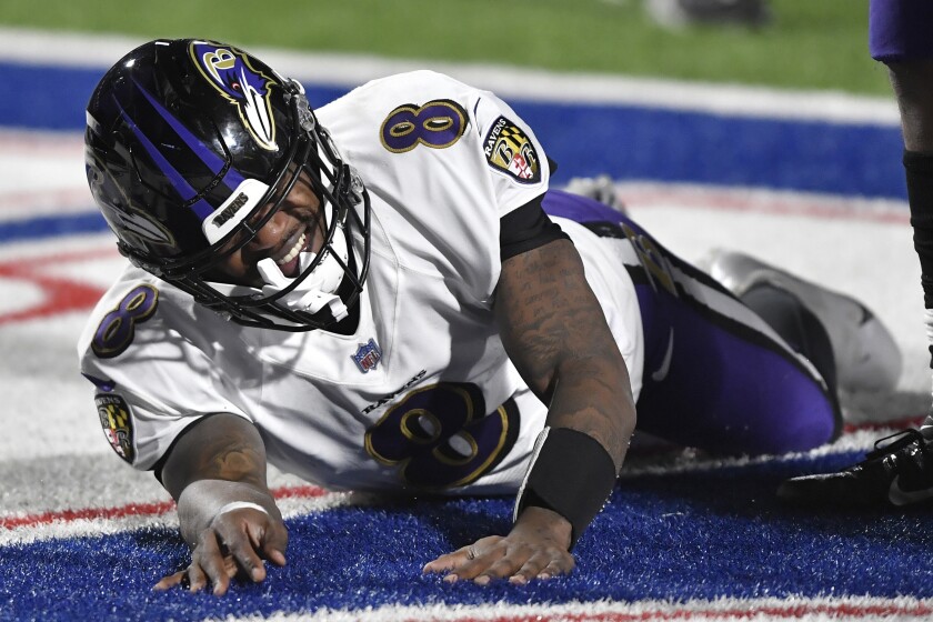 Baltimore Ravens quarterback Lamar Jackson (8) reacts after getting hurt during the second half of an NFL divisional round football game against the Buffalo Bills Saturday, Jan. 16, 2021, in Orchard Park, N.Y. (AP Photo/Adrian Kraus)