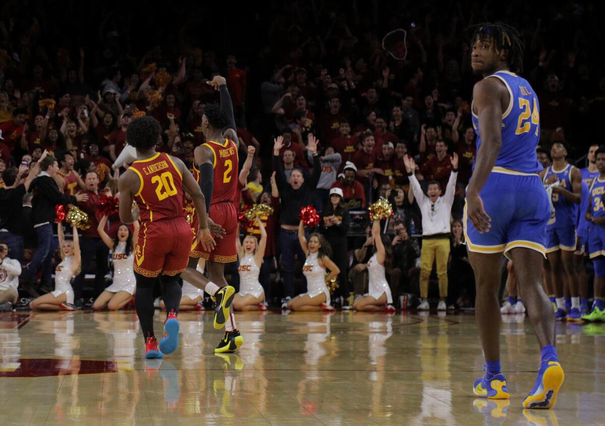 USC guard Jonah Mathews (2) reacts toward the crowd after beating UCLA with a last-second shot in 2020.