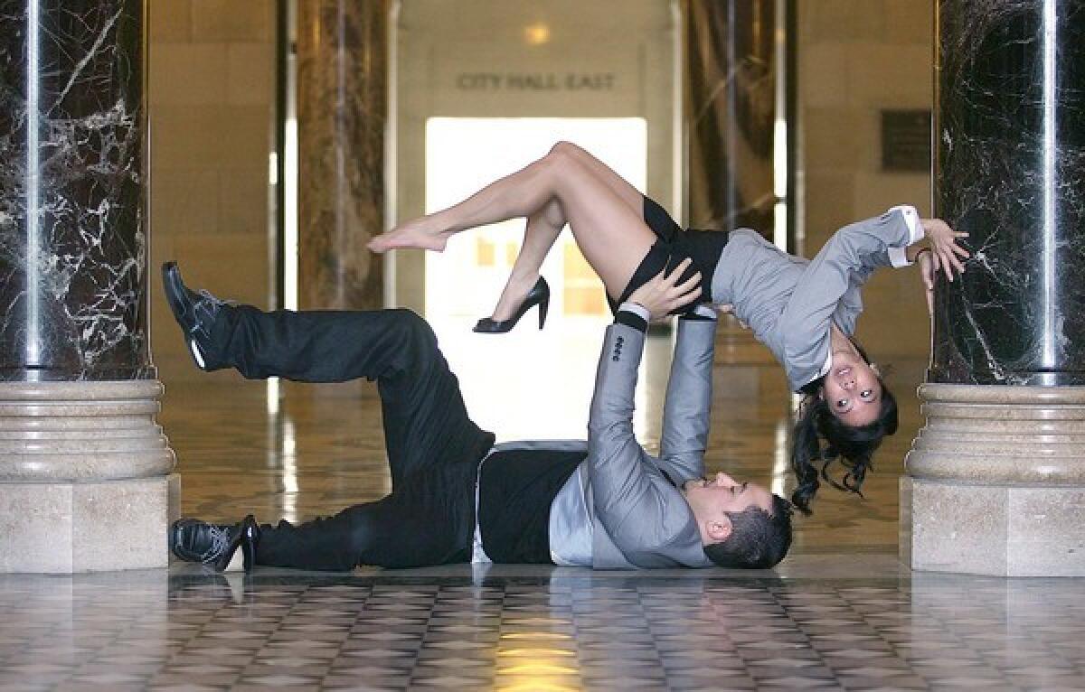 Roberto C. Lambaren and Marissa Labog of Collage Dance Theatre practice in L.A. City Hall. The troupe will premiere "Governing Bodies" there in November.