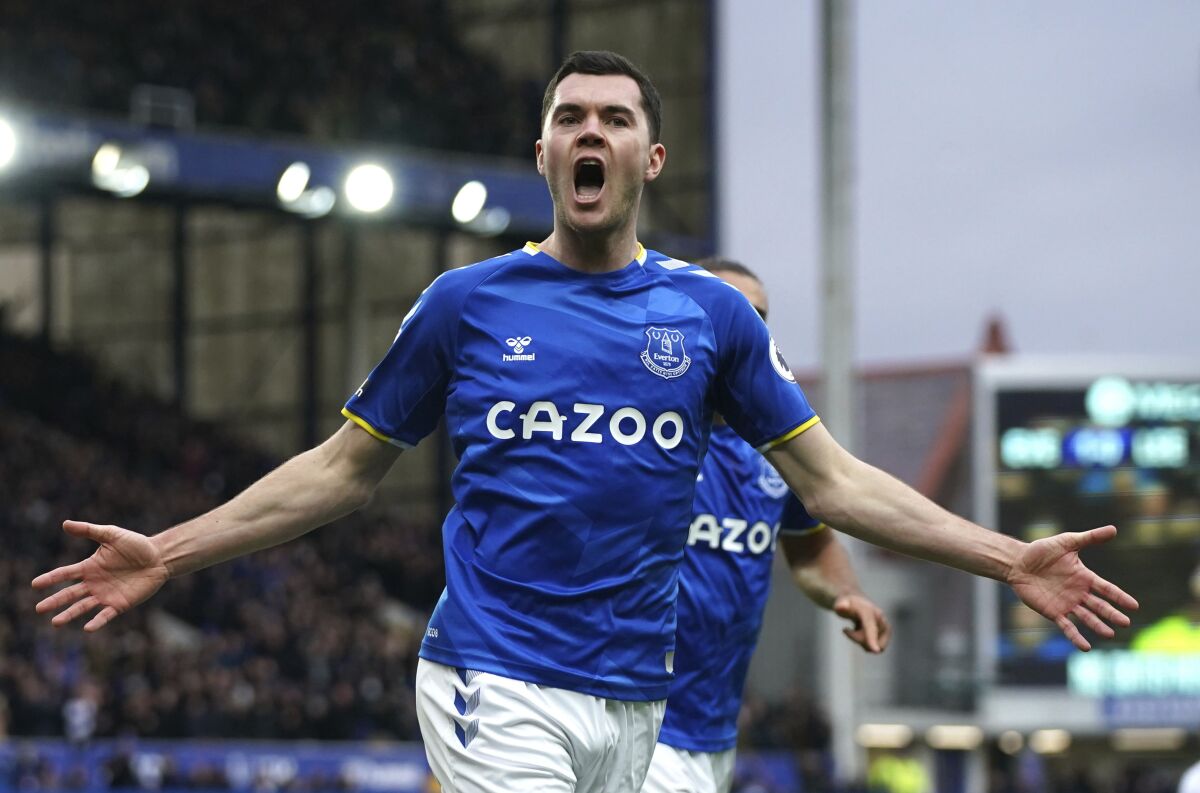 Everton's Michael Keane celebrates scoring during the English Premier League soccer match between Everton and Leeds United at Goodison Park, Liverpool, England, Saturday Feb. 12, 2022. (Peter Byrne/PA via AP)