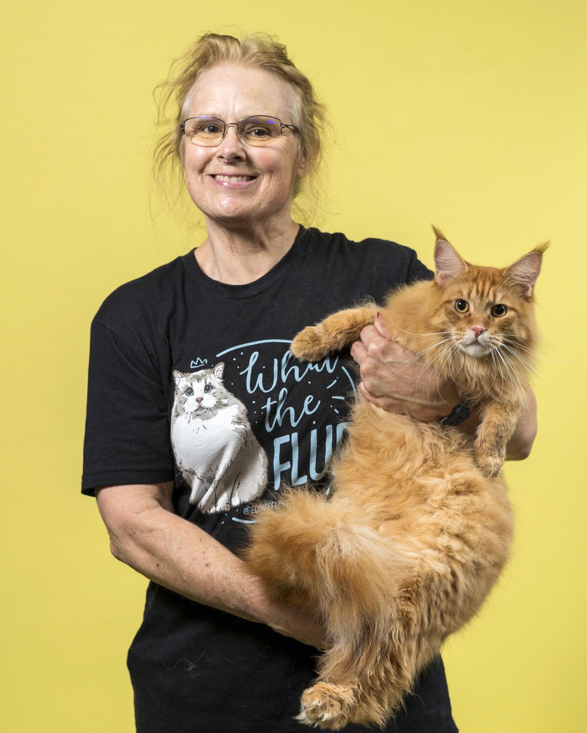 Lynzcey Rkein holds her Maine Coon named Ragnar.