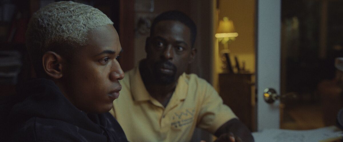 The relationship between Tyler (Kelvin Harrison Jr., left) and his father Ronald (Sterling K. Brown) is defined by Ronald's desire for Tyler to excel at all costs, leaving no room for weakness, vulnerability or emotion.