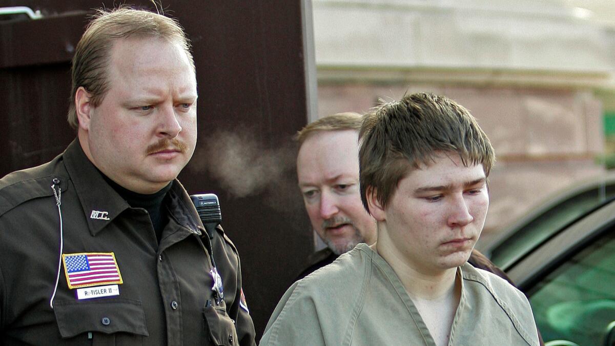 Brendan Dassey is escorted out of a Manitowoc County Circuit courtroom in Manitowoc, Wis., on March 3, 2006.