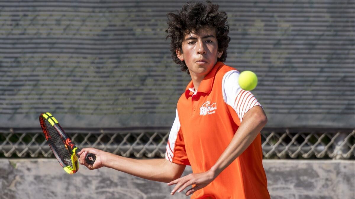 Daniel Izmirian, shown competing on April 12, won the clinching singles set in Huntington Beach High's 10-8 upset of No. 2-seeded San Luis Obispo on Friday.