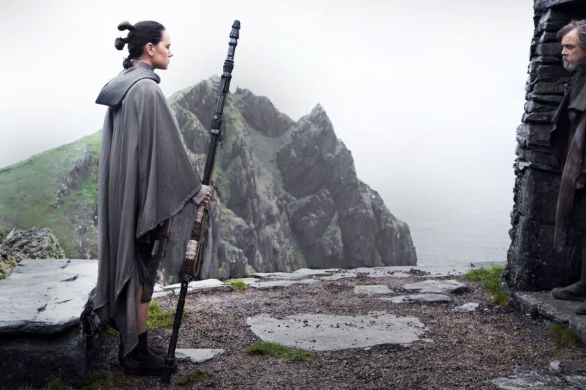 (L-R) - Daisy Ridley as 'Rey' and Mark Hamill as 'Luke Skywalker' in a scene from the movie "Star Wars: The Last Jedi." Credit: Jonathan Olley / Lucasfilm Ltd.