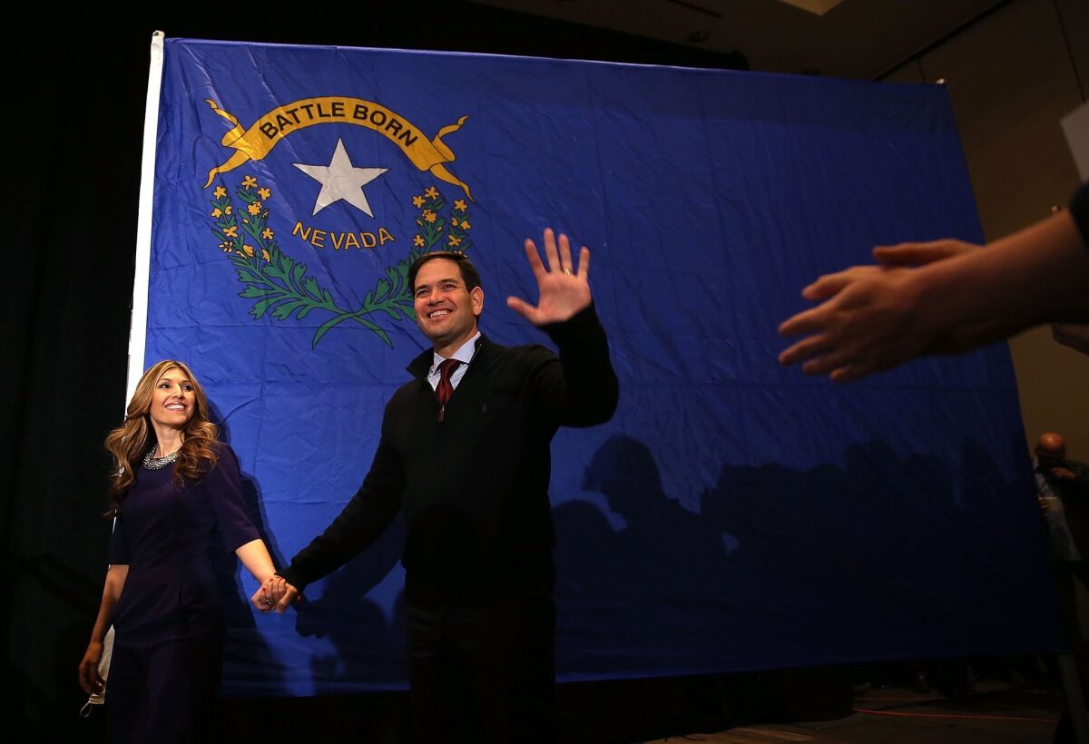 Sen. Marco Rubio and his wife, Jeanette, greet supporters during a campaign rally at the Renaissance Hotel in Las Vegas this month.