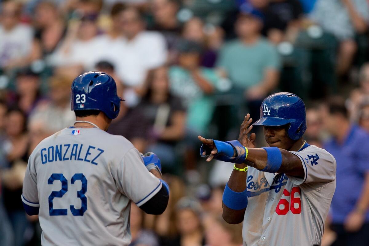 Dodgers first baseman Adrian Gonzalez, left, and right fielder Yasiel Puig are among five players who are eligible for the final roster spot on the National League's All-Star team.