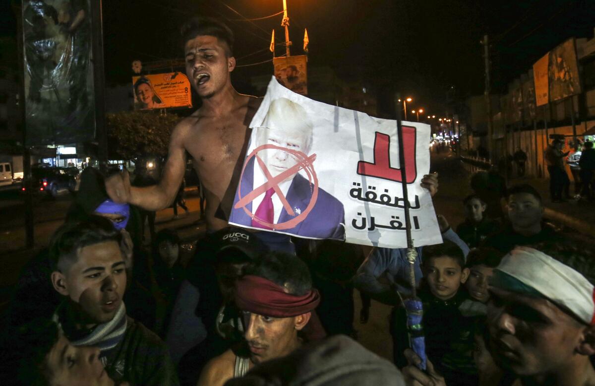 Palestinians in the southern Gaza Strip protest a U.S. peace proposal on Thursday.