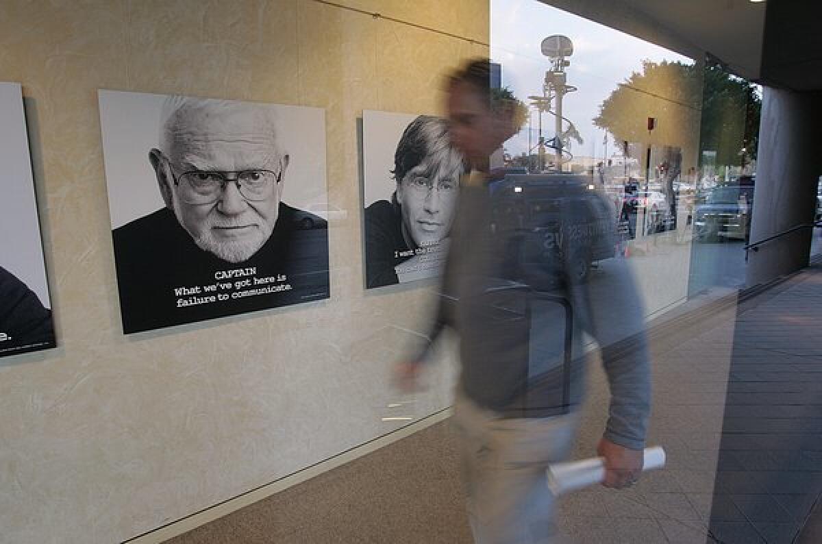 Portraits of famous screenwriters line the front hallway of the offices of the Writers Guild of America, West, which reported record-setting revenues among its members.