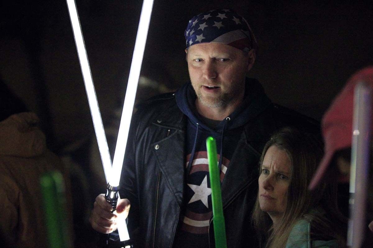 ESCONDIDO, December 30, 2016 | Shawn Richter holds two lightsabers as he and other Star Wars fans gather to pay tribute to actress Carrie Fisher at the California Center for the Arts in Escondido on Friday | Photo by Hayne Palmour IV/San Diego Union-Tribune/Mandatory Credit: HAYNE PALMOUR IV/SAN DIEGO UNION-TRIBUNE/ZUMA PRESS San Diego Union-Tribune Photo by Hayne Palmour IV copyright 2016