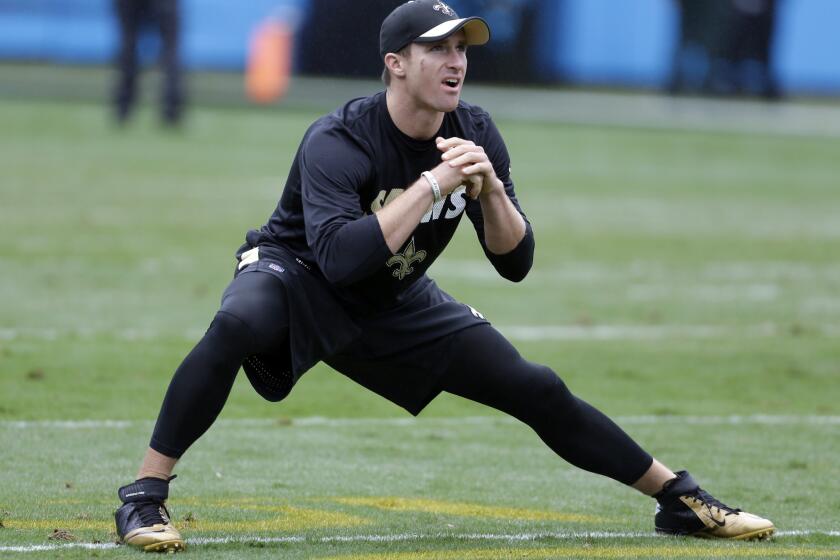 New Orleans Saints quarterback Drew Brees stretches before a game against the Carolina Panthers on Sept. 27.