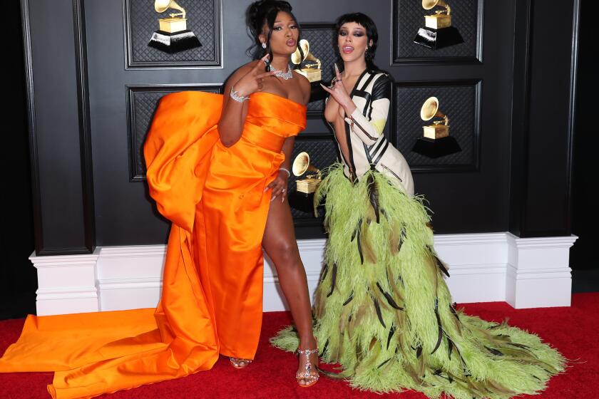 Los Angeles, CA - March 14: Megan Thee Stallion ands Doja Cat on the red carpet at the 63rd Annual Grammy Awards, at the Los Angeles Convention Center, in downtown Los Angeles, CA, Wednesday, Mar. 14, 2021. (Jay L. Clendenin / Los Angeles Times)