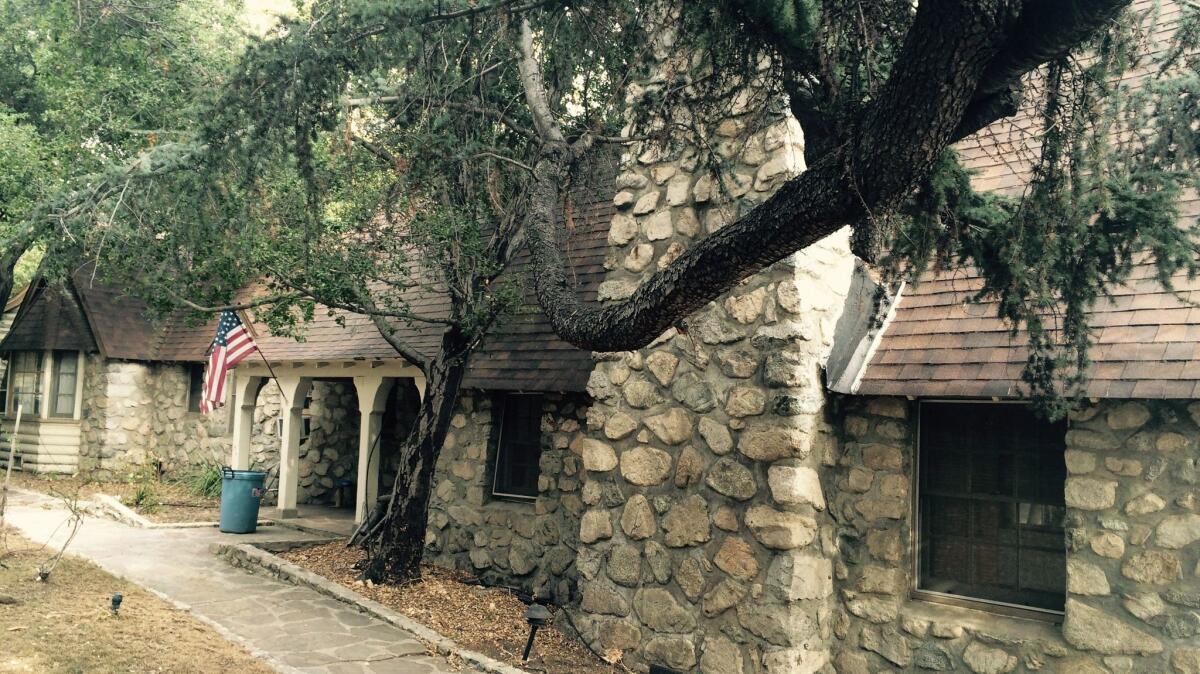This replica Scottish lodge is for sale near Glendale. Will it one day be an orphanage?