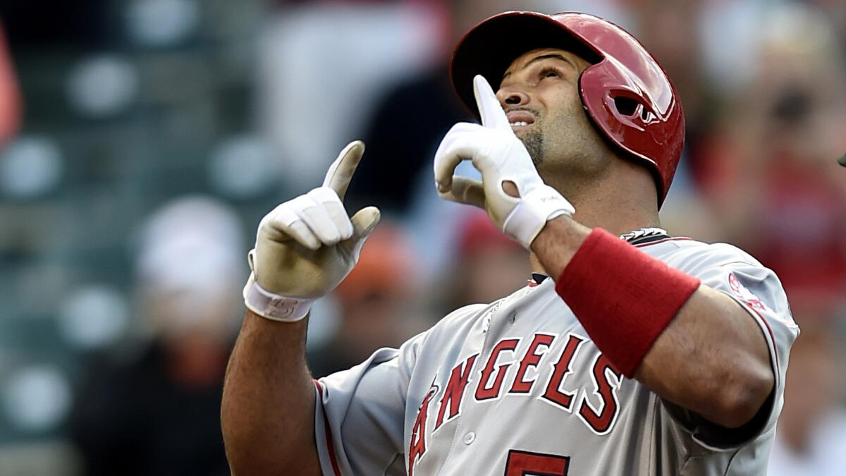 Angels first baseman Albert Pujois reacts after hitting a solo home run against the Orioles in the first inning Friday night in Baltimore.