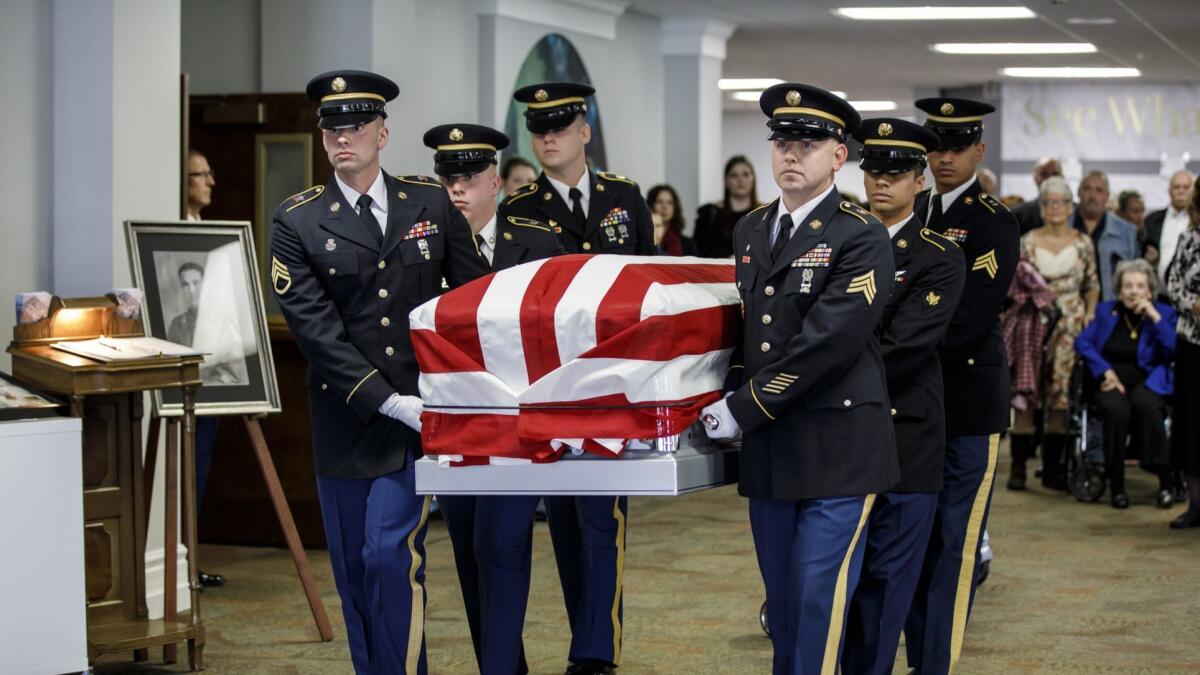 Indiana National Guard Honor Unit troops carry the coffin of Master Sgt. Charles H. McDaniel Sr., who was killed in action during the Korean War and whose remains were returned by the North Korean government.