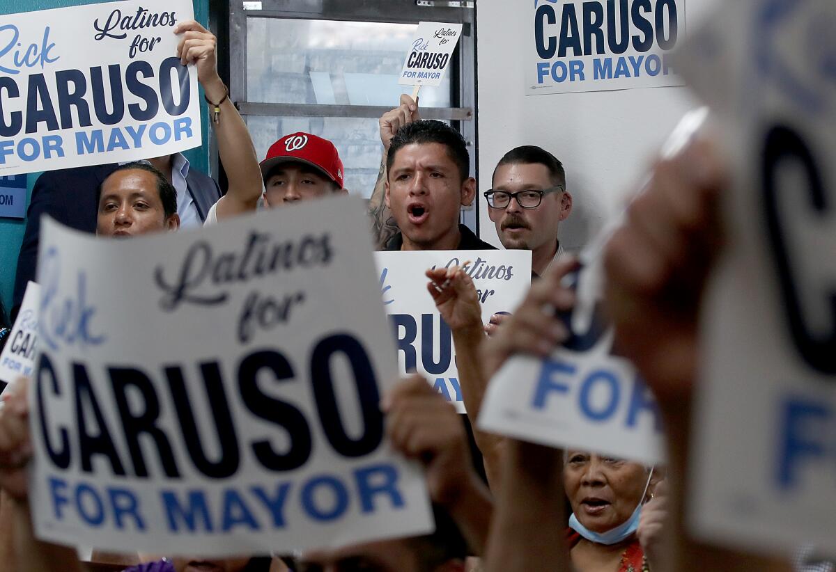Latino supporters of Los Angeles mayoral candidate Rick Caruso gather at a Nicaraguan restaurant in Los Angeles in August.