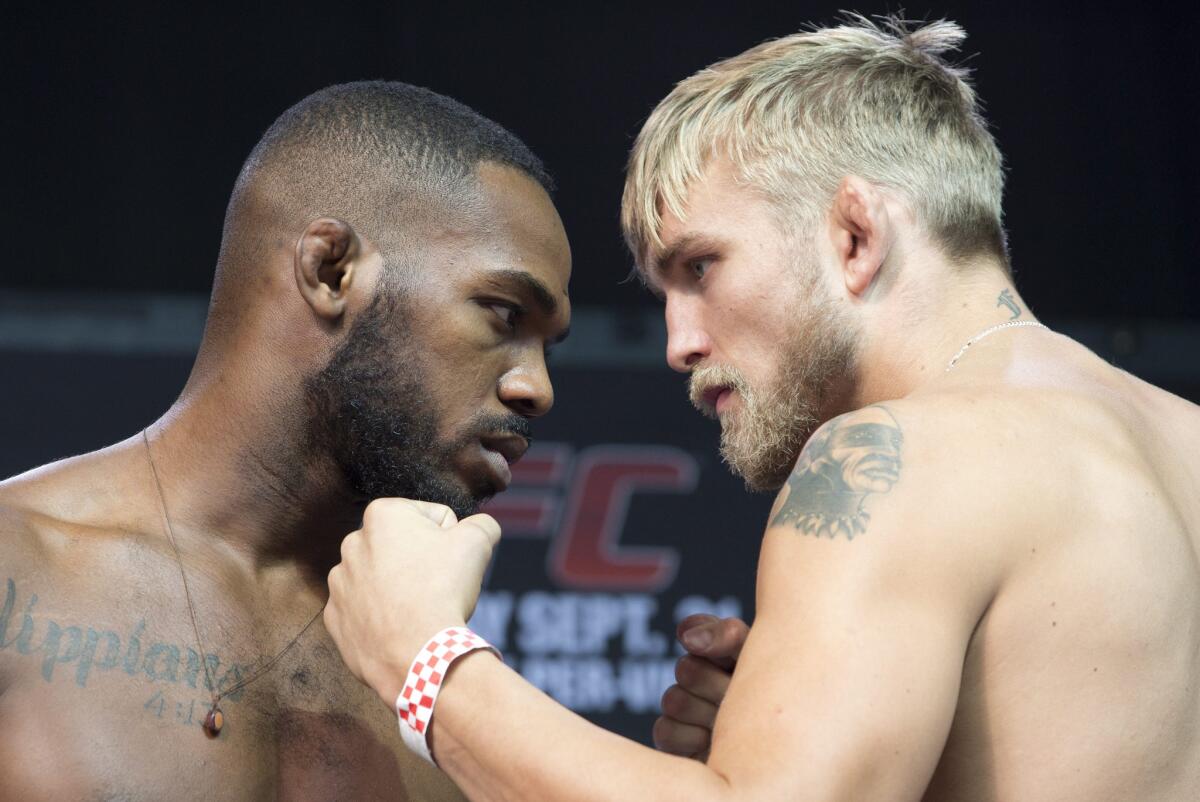 Jon Jones and Alexander Gustafsson pose at a weigh-in before their UFC light heavyweight championship fight in 2013. Jones won the match by decision.