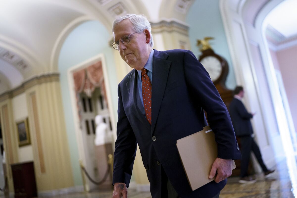 Mitch McConnell walks through the U.S. Capitol 