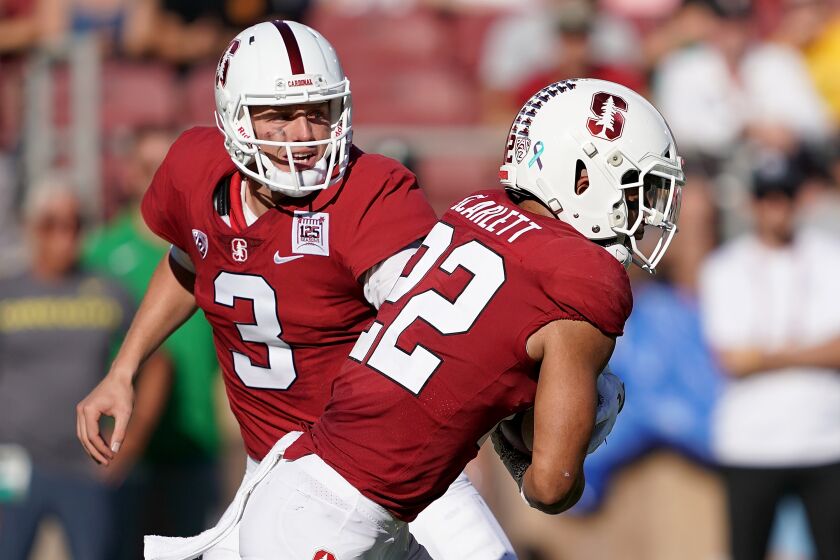 PALO ALTO, CA - SEPTEMBER 21: K.J. Costello #3 of the Stanford Cardinal hands off to running back Cameron Scarlett #22 against the Oregon Ducks during the second quarter of an NCAA football game at Stanford Stadium on September 21, 2019 in Palo Alto, California. (Photo by Thearon W. Henderson/Getty Images) ** OUTS - ELSENT, FPG, CM - OUTS * NM, PH, VA if sourced by CT, LA or MoD **