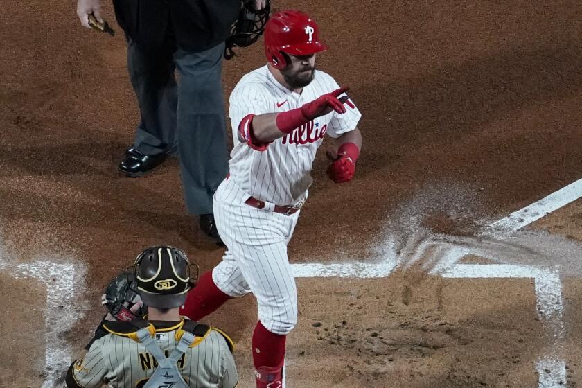 Philadelphia Phillies' Kyle Schwarber celebrates his home run during the first inning in Game 3.