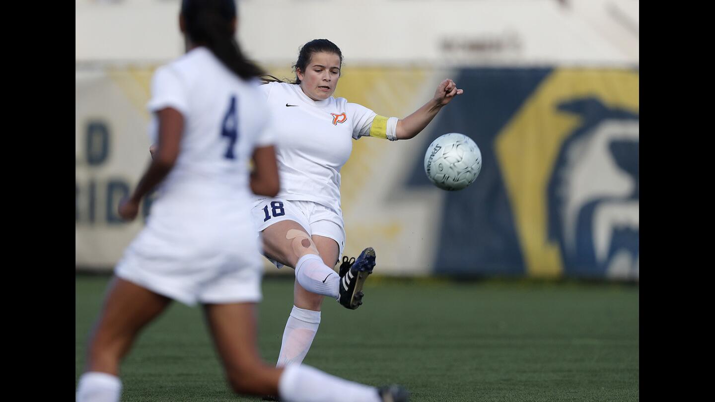 Pacifica Christian Orange County Highâ€™s Olivia Garcia (18) clears the ball out of the back field during the first half against Alhambra Mark Keppel in the CIF Southern Section Division 6 wild-card round playoff game at Vanguard University on Tuesday in Costa Mesa.