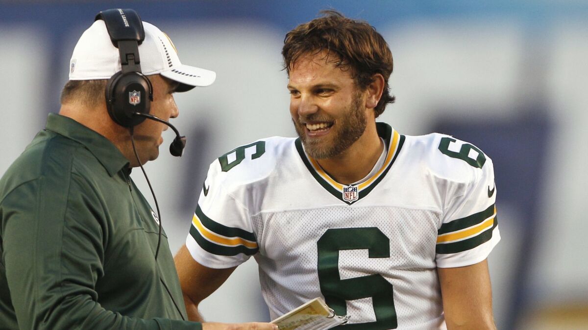 Graham Harrell talks with Green Bay Packers coach Mike McCarthy during a preseason game against the Chargers in 2012.